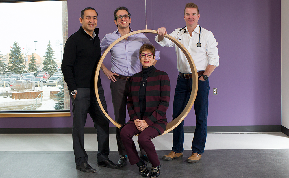 Photo of Drs. navdeep Tangri, Claudio Rigatto and Sean Armstrong with patient Cathy Woods